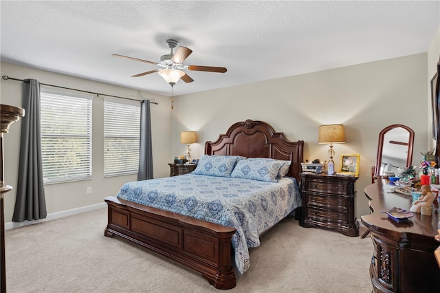 21383 Southern Charm Dr, Land O Lakes, FL 34637 - bedroom with light carpet, baseboards, a ceiling fan, and a textured ceiling