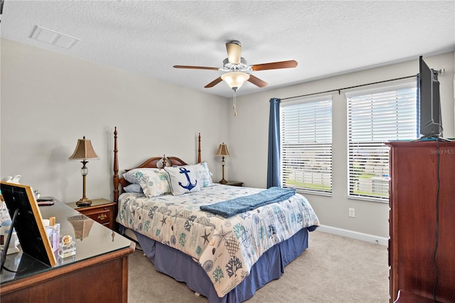 21383 Southern Charm Dr, Land O Lakes, FL 34637 - bedroom featuring light carpet, baseboards, a ceiling fan, and visible vents