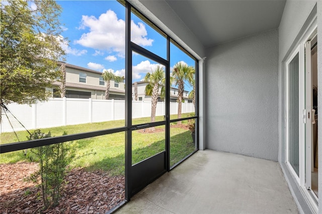 36519 Garden Wall Way, Zephyrhills, FL 33541 - unfurnished sunroom featuring a residential view
