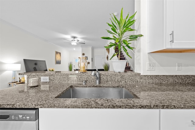 36519 Garden Wall Way, Zephyrhills, FL 33541 - kitchen featuring dishwasher, white cabinets, dark stone countertops, and a ceiling fan