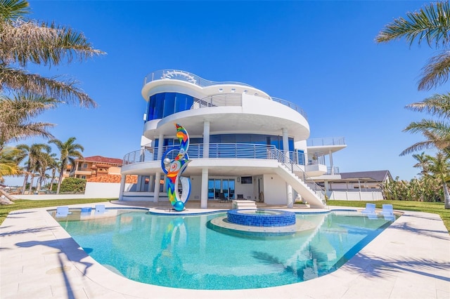 12650 7th St E, Treasure Island, FL 33706 - view of pool featuring stairs, a patio, a pool with connected hot tub, and fence
