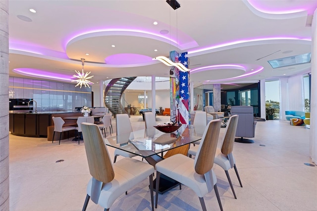 12650 7th St E, Treasure Island, FL 33706 - dining room with light tile patterned floors, recessed lighting, and decorative columns