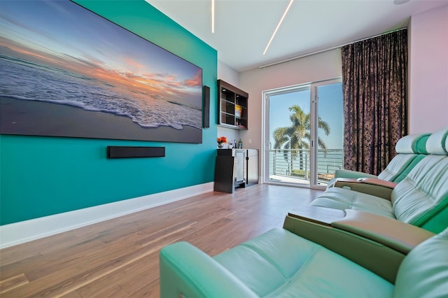 12650 7th St E, Treasure Island, FL 33706 - living room with baseboards and wood finished floors