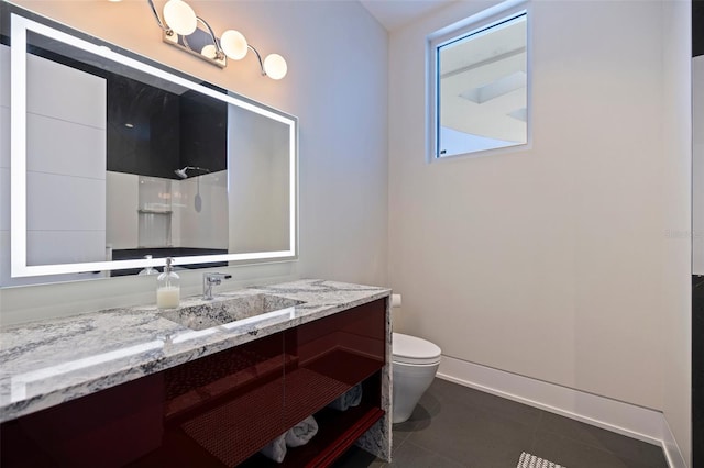 12650 7th St E, Treasure Island, FL 33706 - full bath featuring toilet, baseboards, tile patterned flooring, vanity, and a shower