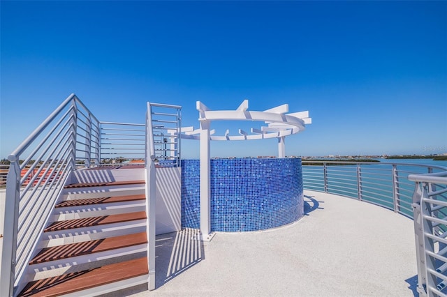 12650 7th St E, Treasure Island, FL 33706 - view of pool with a water view