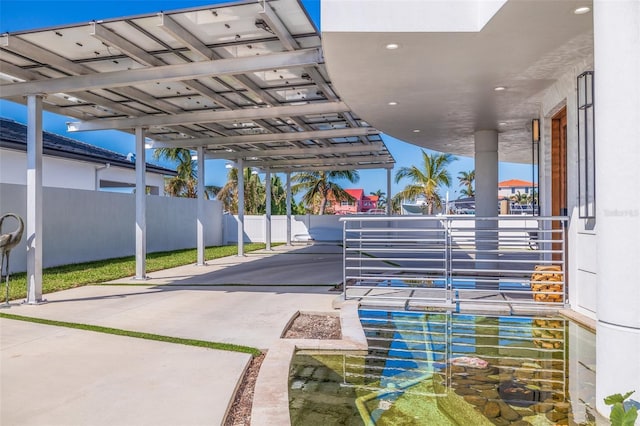 12650 7th St E, Treasure Island, FL 33706 - view of patio with fence