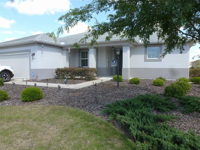 8890 SW 104th Cir, Ocala, FL 34481 - ranch-style home with a garage and stucco siding