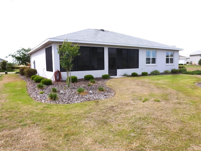8890 SW 104th Cir, Ocala, FL 34481 - back of house with a lawn, stucco siding, and roof with shingles
