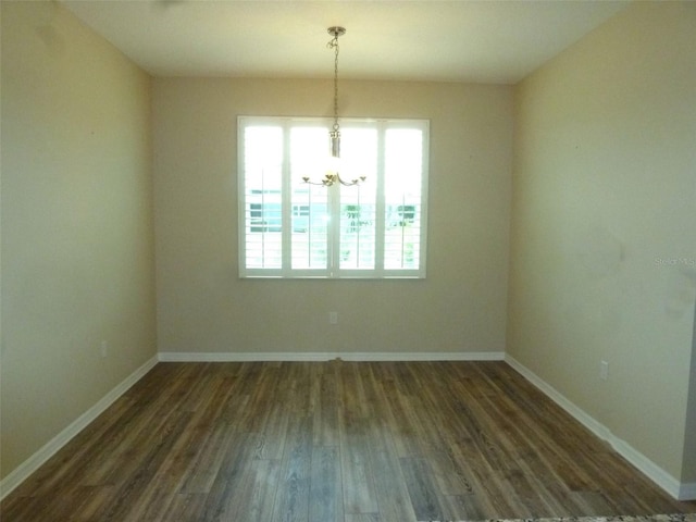 8890 SW 104th Cir, Ocala, FL 34481 - unfurnished dining area featuring healthy amount of natural light, dark wood finished floors, a chandelier, and baseboards