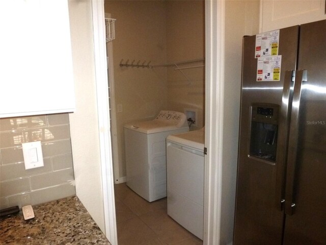 8890 SW 104th Cir, Ocala, FL 34481 - laundry room with washing machine and dryer and light tile patterned floors