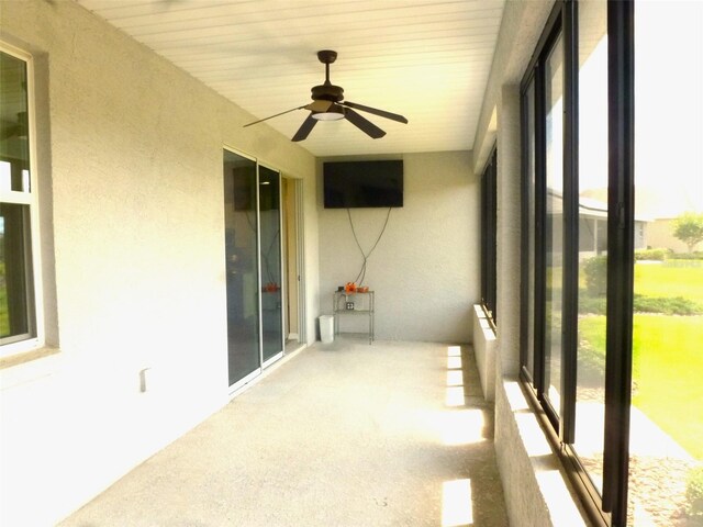 8890 SW 104th Cir, Ocala, FL 34481 - unfurnished sunroom featuring a ceiling fan and healthy amount of natural light
