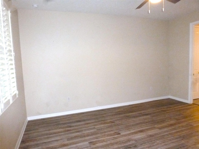 8890 SW 104th Cir, Ocala, FL 34481 - empty room featuring a ceiling fan, dark wood-style flooring, and baseboards