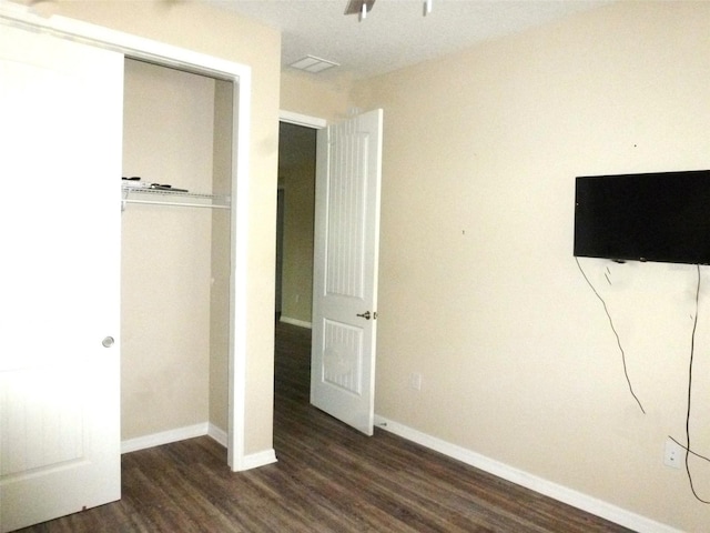 8890 SW 104th Cir, Ocala, FL 34481 - unfurnished bedroom featuring wood finished floors, a closet, and baseboards