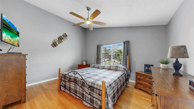 1613 E Del Webb Blvd, Sun City Center, FL 33573 - bedroom with light wood-style floors, vaulted ceiling, baseboards, and ceiling fan