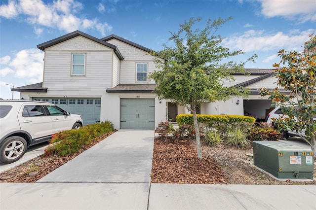 5429 Companion Ln, Tampa, FL 33619 - view of property with concrete driveway, an attached garage, and stucco siding