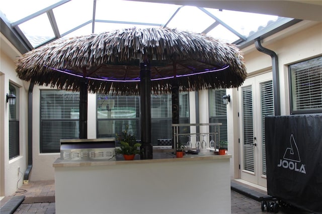 1509 Amarone Pl, Lutz, FL 33548 - view of patio with an outdoor kitchen and glass enclosure