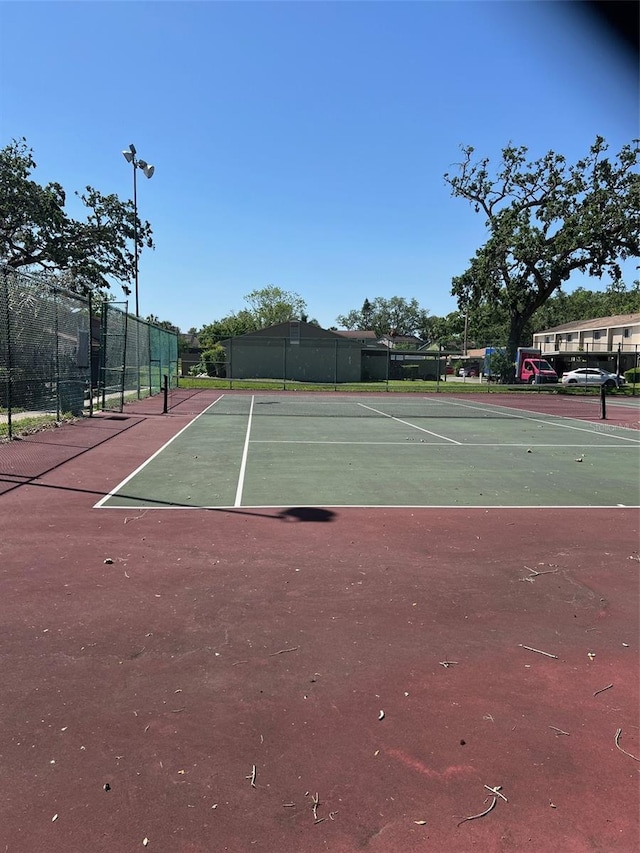 view of sport court with fence