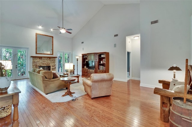 16420 Iola Woods Trl, Dade City, FL 33523 - living room with high vaulted ceiling, visible vents, light wood-type flooring, and a ceiling fan