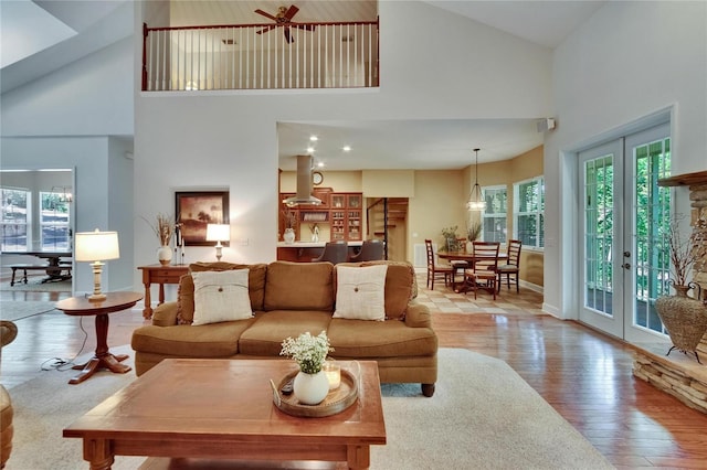 16420 Iola Woods Trl, Dade City, FL 33523 - living area with french doors, high vaulted ceiling, and wood finished floors
