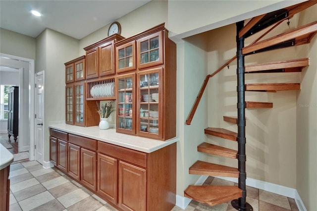 16420 Iola Woods Trl, Dade City, FL 33523 - mudroom featuring light tile patterned floors and baseboards