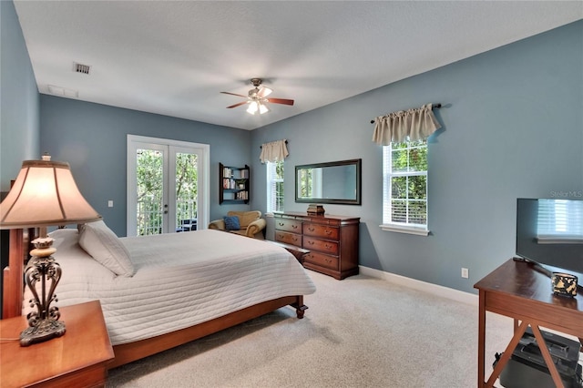 16420 Iola Woods Trl, Dade City, FL 33523 - carpeted bedroom featuring multiple windows, french doors, access to exterior, and visible vents
