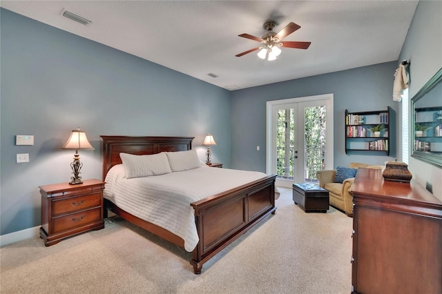 16420 Iola Woods Trl, Dade City, FL 33523 - bedroom featuring access to outside, french doors, light colored carpet, and visible vents
