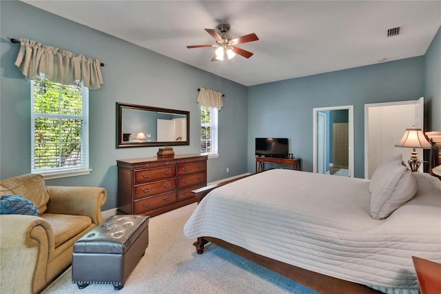 16420 Iola Woods Trl, Dade City, FL 33523 - bedroom with visible vents, multiple windows, a ceiling fan, and carpet floors