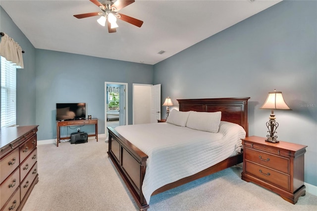 16420 Iola Woods Trl, Dade City, FL 33523 - bedroom with visible vents, baseboards, ceiling fan, and light colored carpet