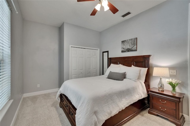 16420 Iola Woods Trl, Dade City, FL 33523 - bedroom featuring ceiling fan, a closet, visible vents, light carpet, and baseboards