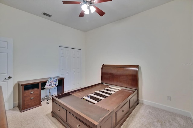 16420 Iola Woods Trl, Dade City, FL 33523 - bedroom featuring light carpet, a closet, baseboards, and visible vents
