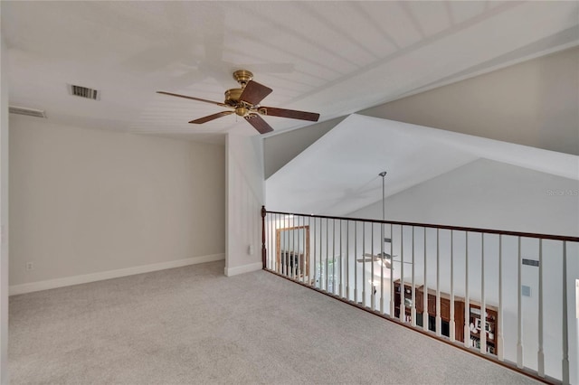 16420 Iola Woods Trl, Dade City, FL 33523 - carpeted empty room with visible vents, ceiling fan, baseboards, and lofted ceiling