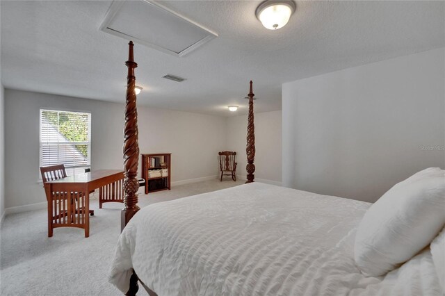16420 Iola Woods Trl, Dade City, FL 33523 - bedroom with baseboards, attic access, light carpet, and a textured ceiling