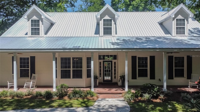 16420 Iola Woods Trl, Dade City, FL 33523 - view of front of property with a porch, a ceiling fan, and metal roof