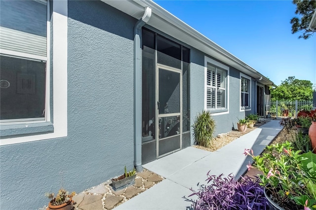 8116 Sanguinelli Rd, Land O Lakes, FL 34637 - view of side of home with stucco siding