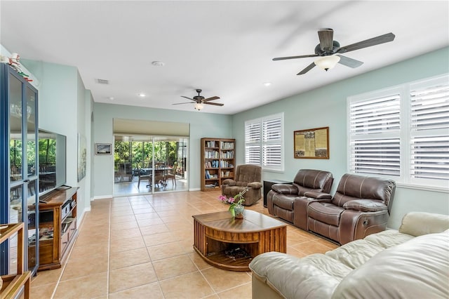 8116 Sanguinelli Rd, Land O Lakes, FL 34637 - living room with a ceiling fan, light tile patterned floors, baseboards, visible vents, and recessed lighting