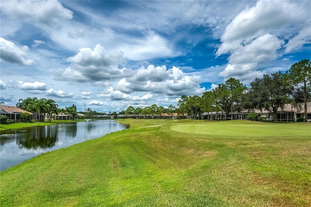 8116 Sanguinelli Rd, Land O Lakes, FL 34637 - surrounding community with view of golf course, a yard, and a water view
