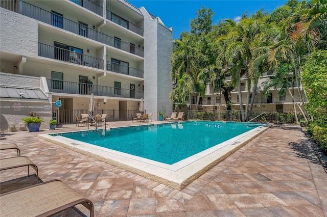 105 4th Ave NE Unit 220, Saint Petersburg, FL 33701 - view of swimming pool with fence