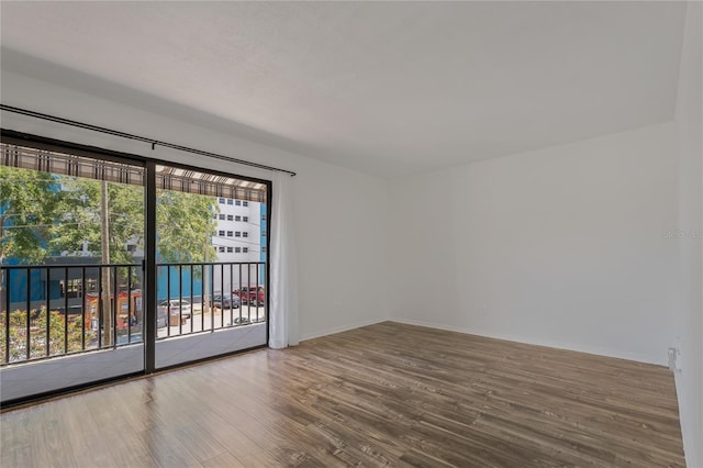 105 4th Ave NE Unit 220, Saint Petersburg, FL 33701 - empty room with wood finished floors and baseboards