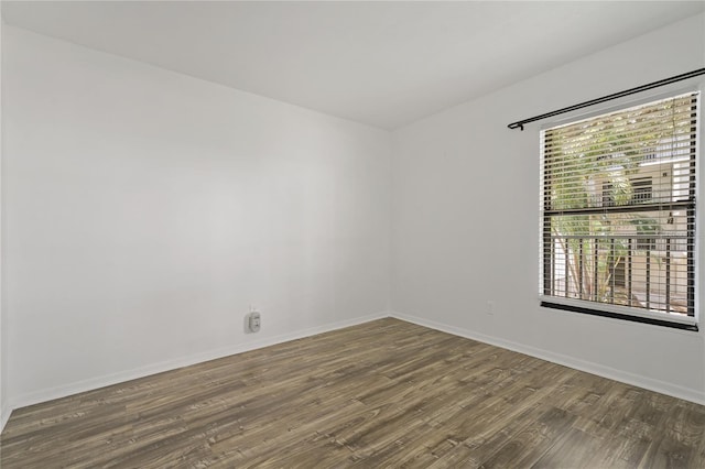 105 4th Ave NE Unit 220, Saint Petersburg, FL 33701 - unfurnished room featuring wood finished floors and baseboards