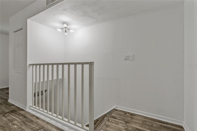 105 4th Ave NE Unit 220, Saint Petersburg, FL 33701 - interior space with a textured ceiling, wood finished floors, baseboards, and visible vents