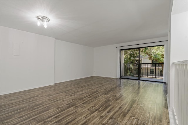 105 4th Ave NE Unit 220, Saint Petersburg, FL 33701 - spare room featuring baseboards and wood finished floors