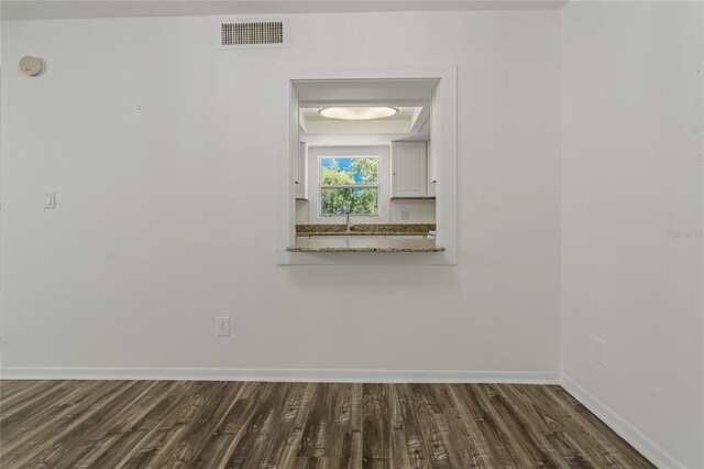 105 4th Ave NE Unit 220, Saint Petersburg, FL 33701 - interior space with dark wood-type flooring, baseboards, and visible vents