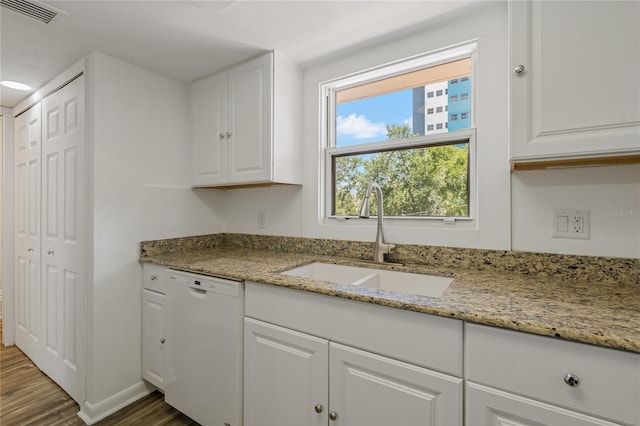 105 4th Ave NE Unit 220, Saint Petersburg, FL 33701 - kitchen featuring white cabinetry, visible vents, white dishwasher, a sink, and wood finished floors