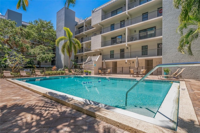 105 4th Ave NE Unit 220, Saint Petersburg, FL 33701 - view of pool featuring a patio area and fence