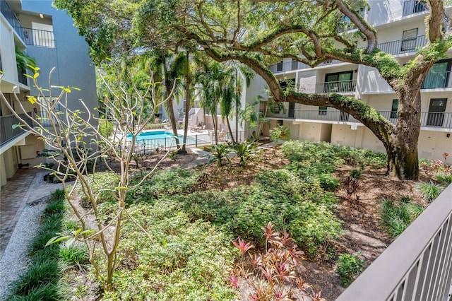 105 4th Ave NE Unit 220, Saint Petersburg, FL 33701 - view of yard featuring a community pool