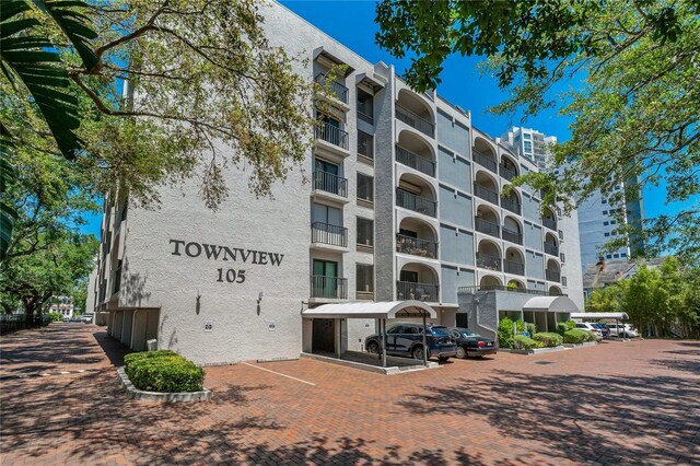 105 4th Ave NE Unit 220, Saint Petersburg, FL 33701 - view of building exterior with uncovered parking