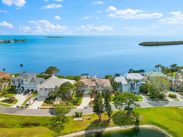 birds eye view of property with a residential view and a water view