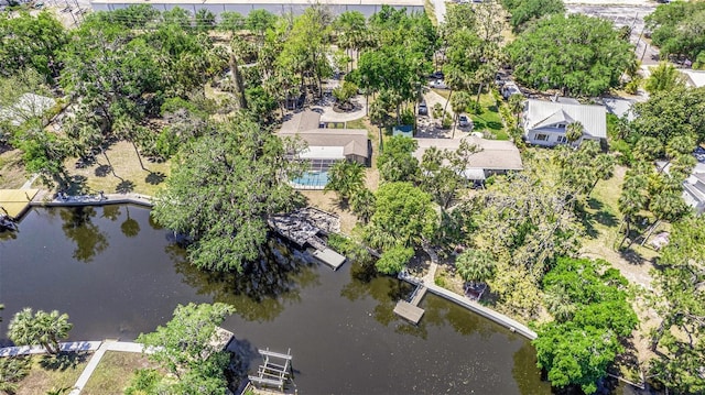 birds eye view of property featuring a water view and a residential view