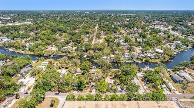 birds eye view of property featuring a water view and a residential view