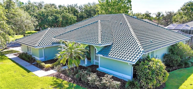 9159 Highland Ridge Way, Tampa, FL 33647 - exterior details featuring stucco siding, a downspout, gutters, and a tile roof